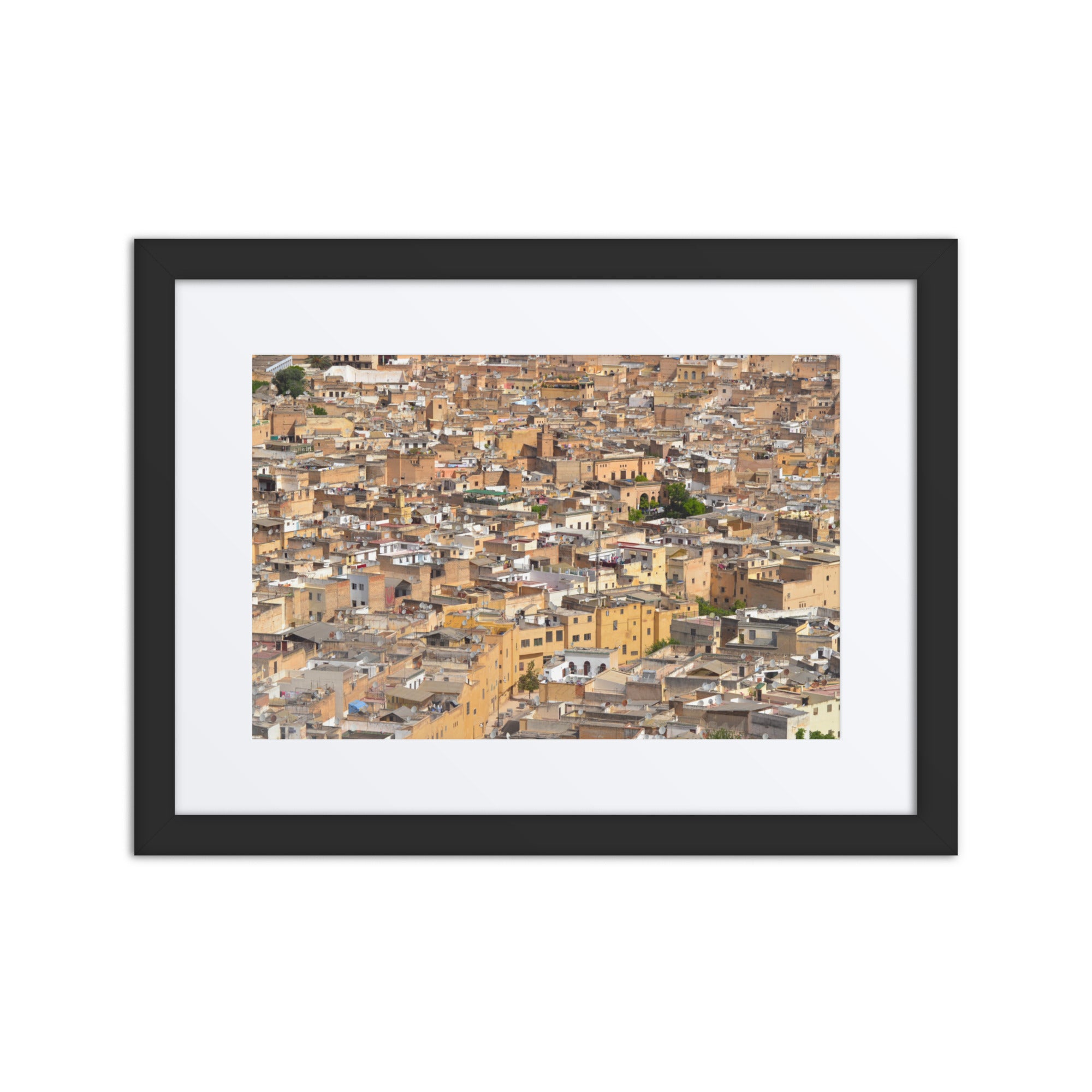 Framed artwork of a cityscape with brown and beige tones.