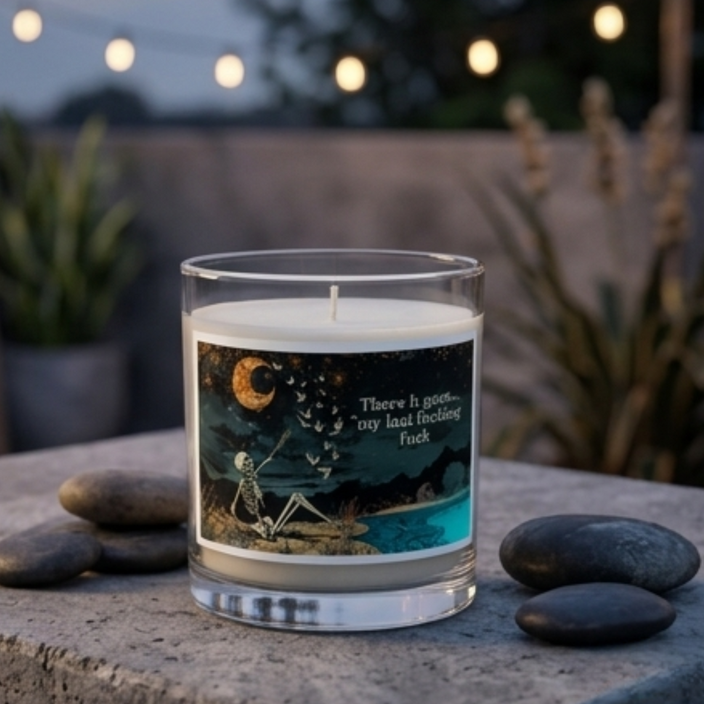 A lit My Last Flying Fuck Glass jar soy wax candle creating a warm and inviting ambiance in a room.