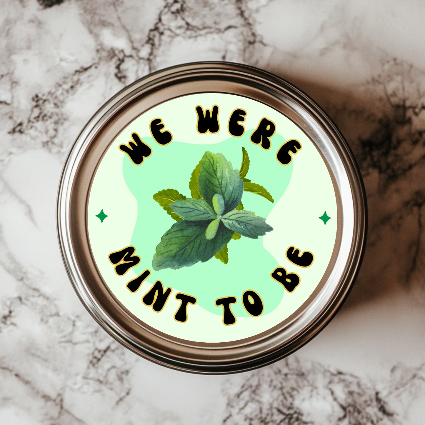 We Were Mint To Be Sticker featuring a vibrant mint leaf design on a green background, ideal for plant lovers as a decorative gift tag or home decor. This waterproof vinyl sticker is perfect for herb jar labeling and showcases a charming pun.