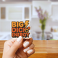 Hand holding a sticker with 'BIG DICK ENERGY' text in a kitchen setting