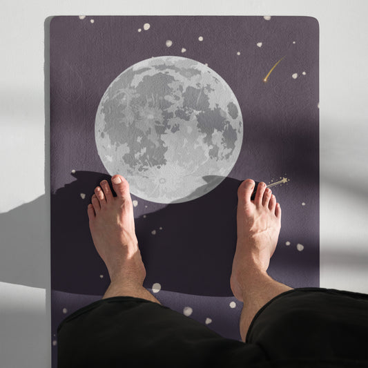 Meteor shower yoga mat featuring a full moon design with falling stars, shown in use with feet positioned on the mat.