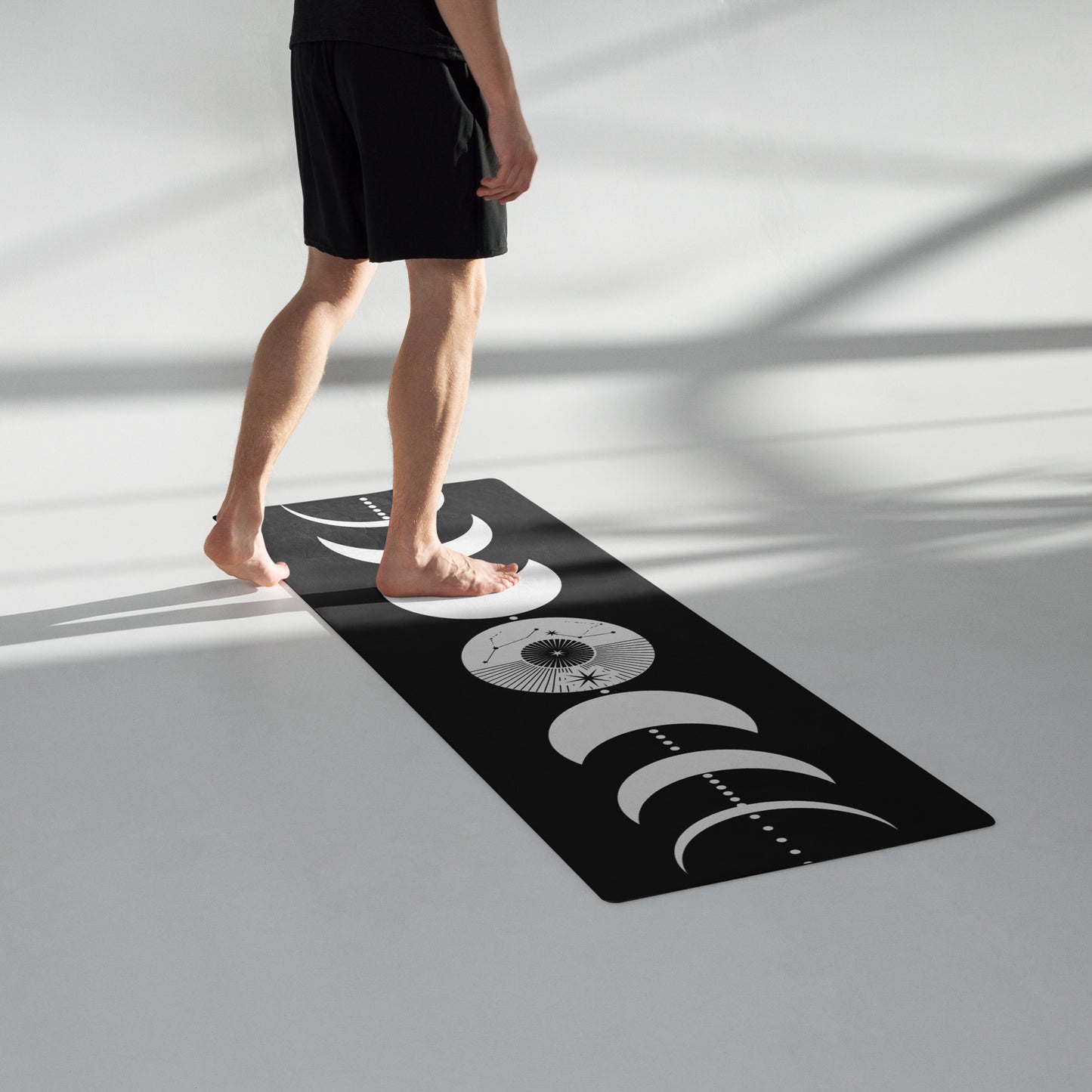 Moon cycles yoga mat featuring a minimalist black and white design with crescent moon phases arranged vertically.