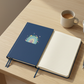 Rainbow notebook on desk with coffee