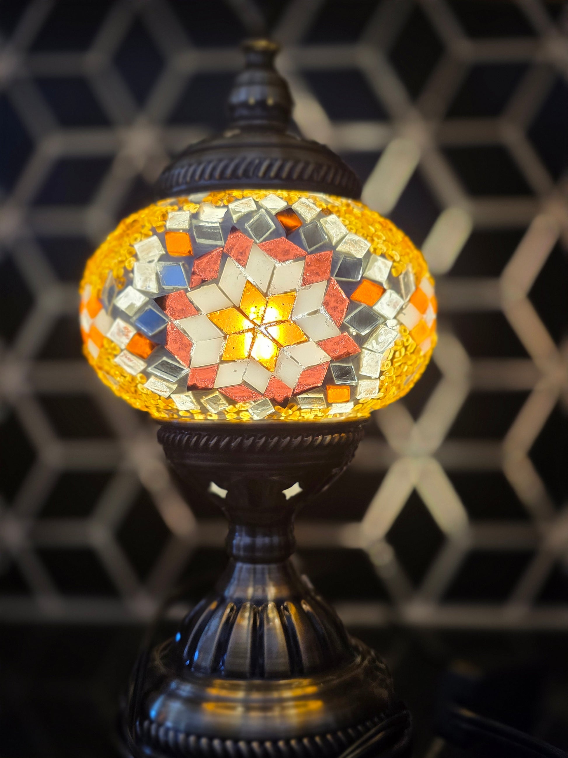 Close-up of Golden Star Turkish Mosaic Lamp, featuring intricate star patterns and a vibrant mosaic of colorful glass.