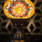 Golden Star Turkish Mosaic Lamp in a serene setting, embodying beauty and tranquility with its exquisite glass design.