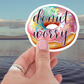 Donut Worry Waterproof Vinyl Sticker featuring a pastel icing donut with colorful sprinkles, perfect as a decoration for laptops and water bottles. A popular choice among donut themed stickers.
