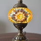Golden Star Turkish Mosaic Lamp placed elegantly in a cozy space, radiating soft golden light for ambiance.
